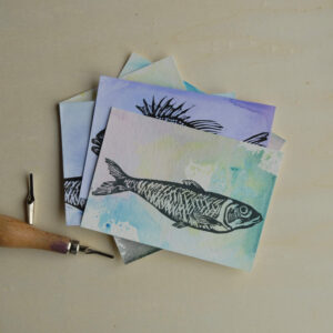 Card set Fish handprinted on coloured background