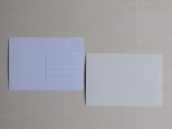 backside of greeting cards. one card is a postcard, one is blank.