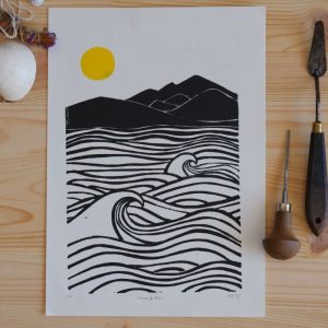 art print showinh waves and mountains and a sun