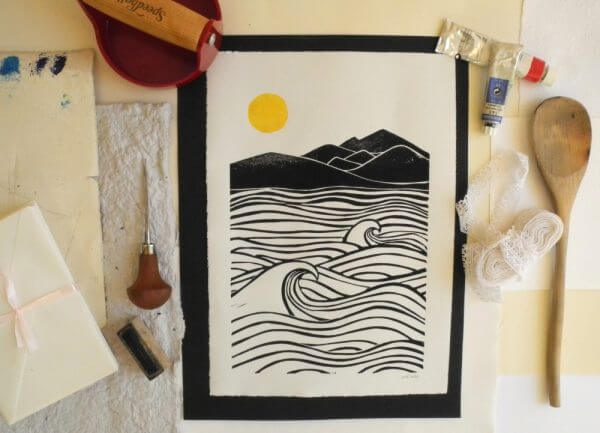 art print of ocean, waves and hills with a yellow sun