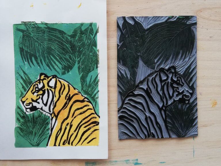Linoblock of a tiger with the Print in orange and green